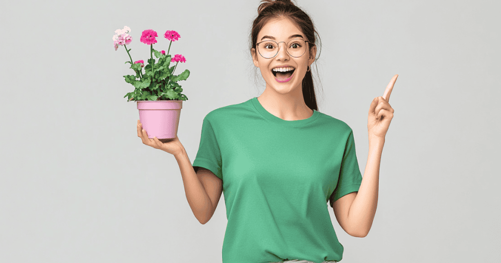 Girl holding up one finger and holding a plant in the other hand