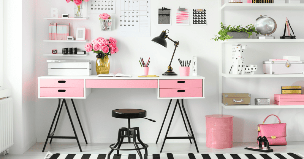 Pink and black home office that has been decluttered and organized