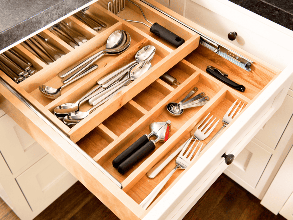 A two level kitchen drawer organizer with dividers.