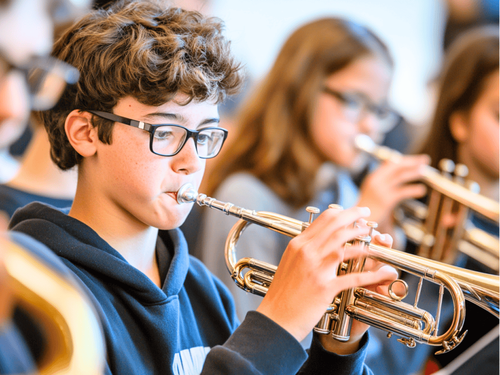 Grade school kids playing band instruments