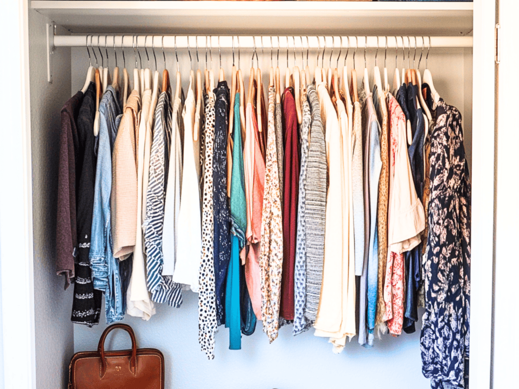 A closet cluttered with clothes