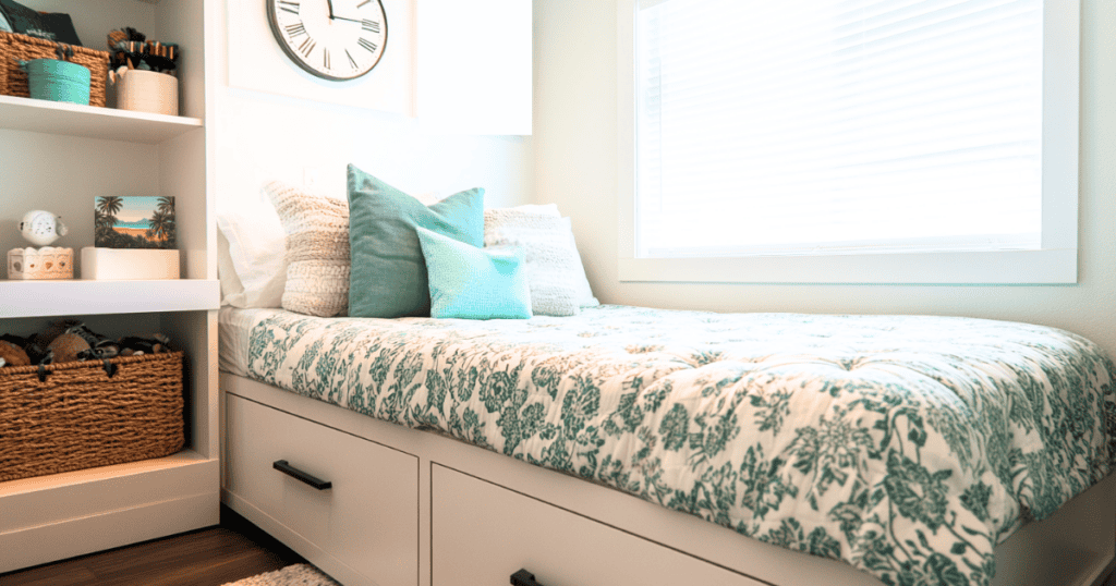 Twin size bed with white drawers underneath