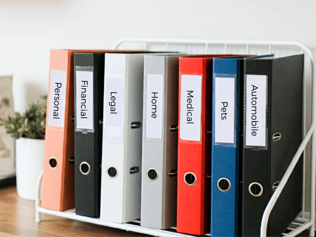 Multi-colored binders with labels on them