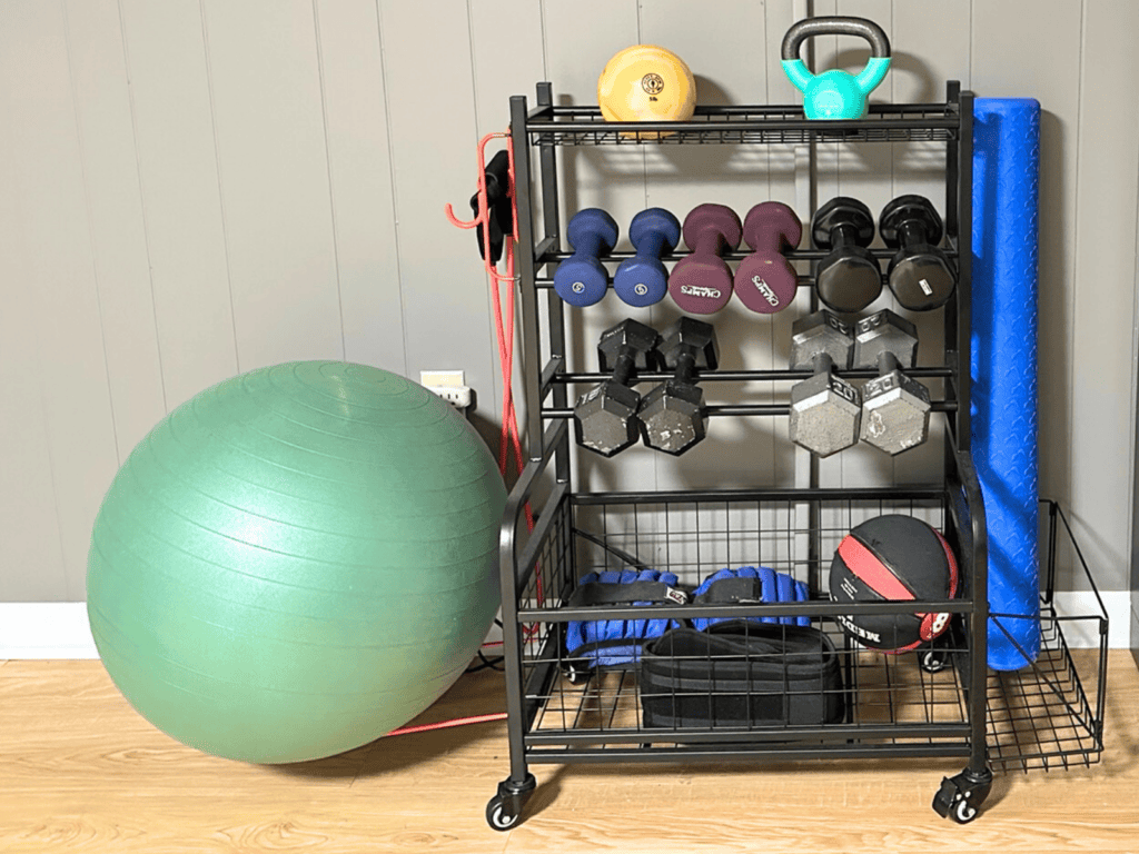 Shelves, baskets, and hooks holding gym equipment in my home gym