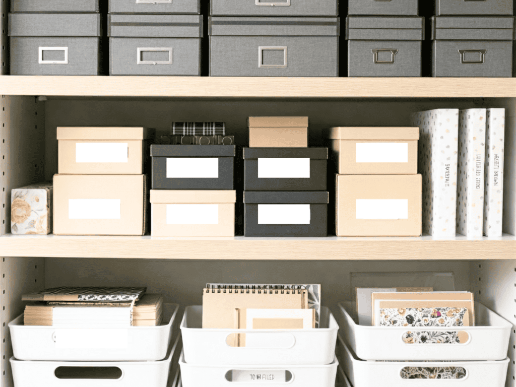 Three shelves with boxes for filing paperwork