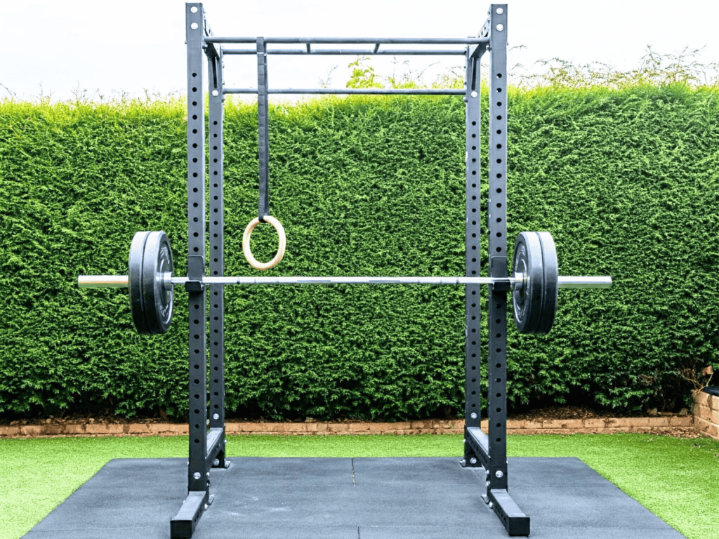 Outdoor home gym with barbells on a mat