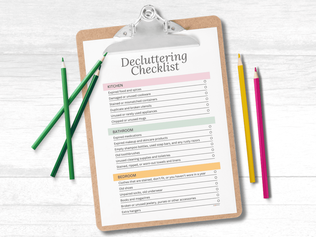 A decluttering checklist on a clipboard and colored pencils laying nearby.