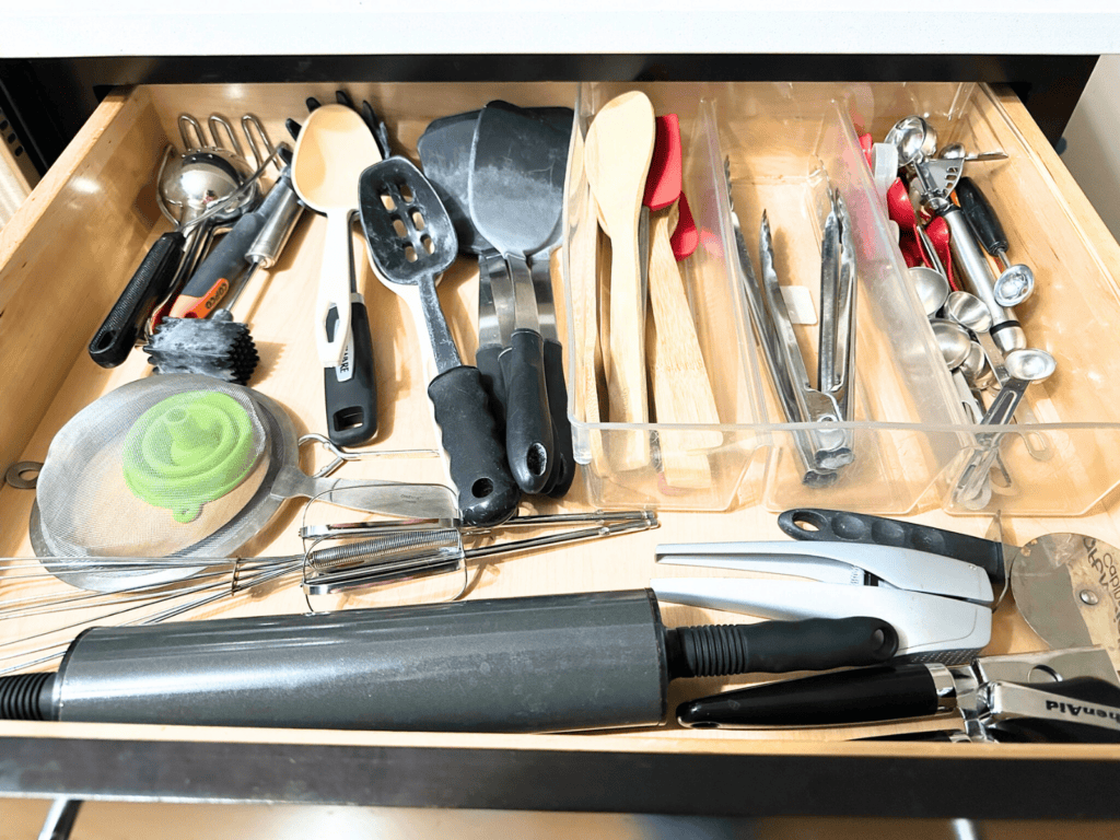 My cluttered utensil drawer.